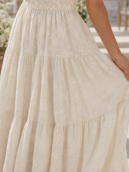 Elaria | Robe midi à manches courtes avec détails floraux texturés