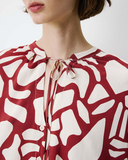 Blouse col V à imprimé géométrique terracotta Ambrine